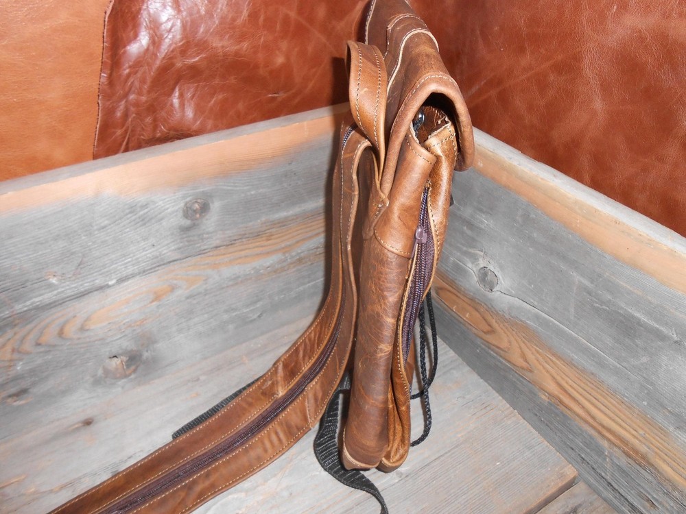 Leather backpack.New small to medium sized backpack spacious with zipper pockets