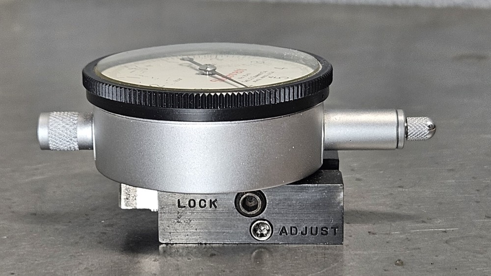 Starrett No. 25-111 dial indicator with No. 674-2 adjustable mounting bracket