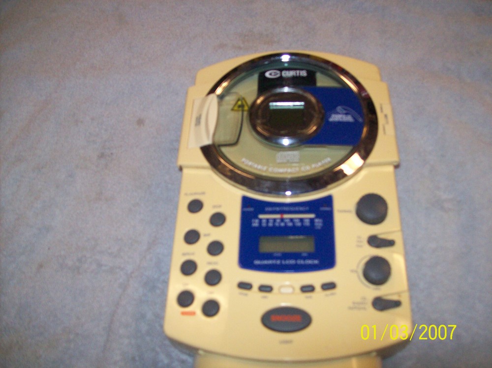 CURTIS MODEL RS57A PORTABLE COMPACT CD PLAYER