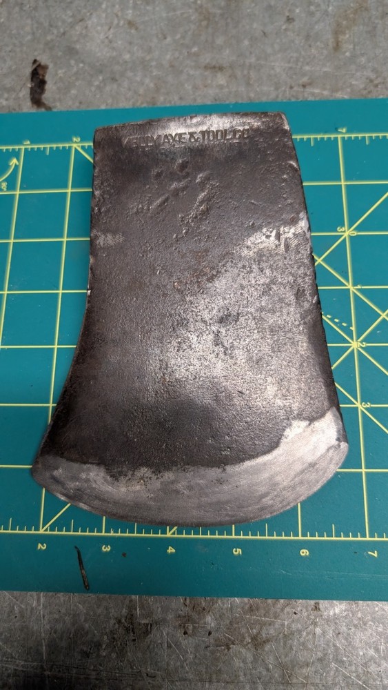 Kelly works axe and tool