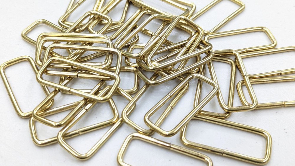 1.5 inch wide brass plated steel strap keeper loop