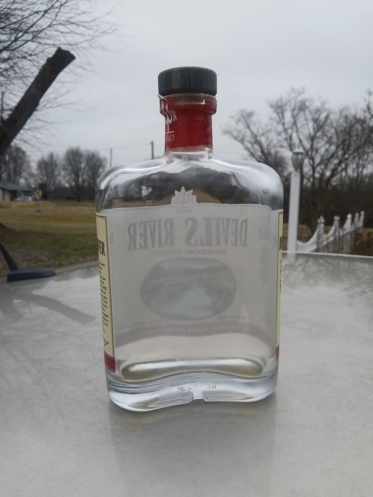 Empty Corked Bottle Of Devil's River Barrel Bourbon Whiskey