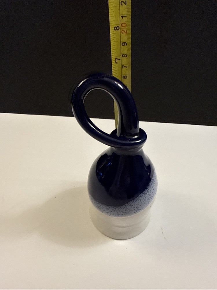 Handmade studio pottery drinking horn with a looped handle.