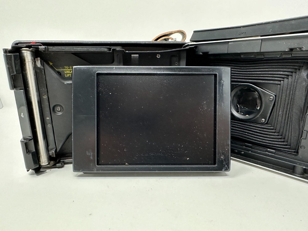 Polaroid Folding Land Camera Vintage Automatic 100 with strap booklets UNTESTED