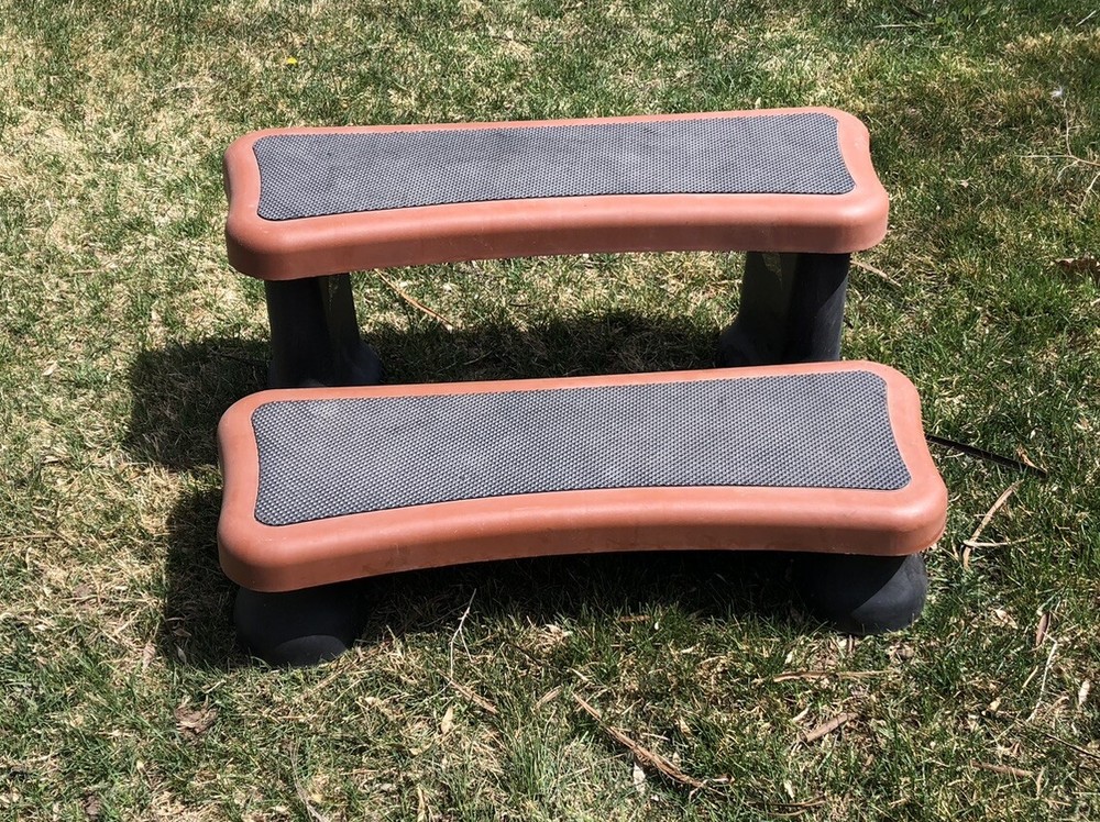 hot tub / spa steps in rust colored plastic..