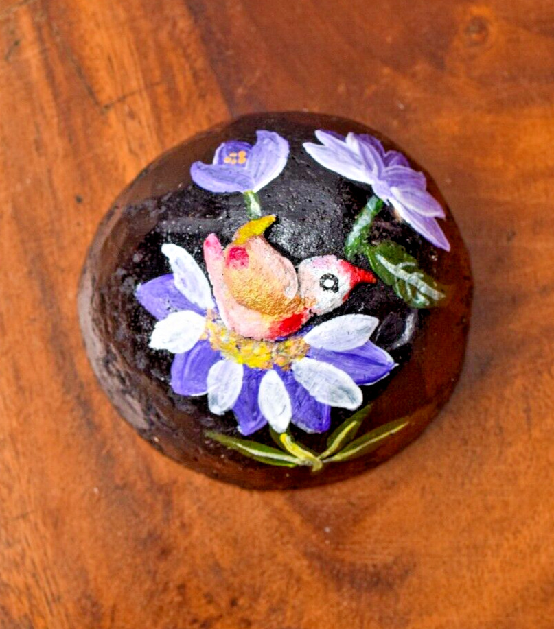 Coconut shells hand painted with different faces specified for hotel decorations