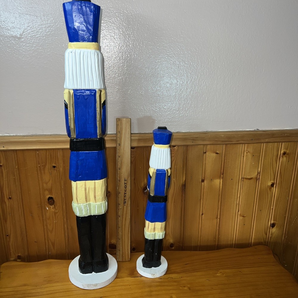 2 Tall decorative nutcracker figurines