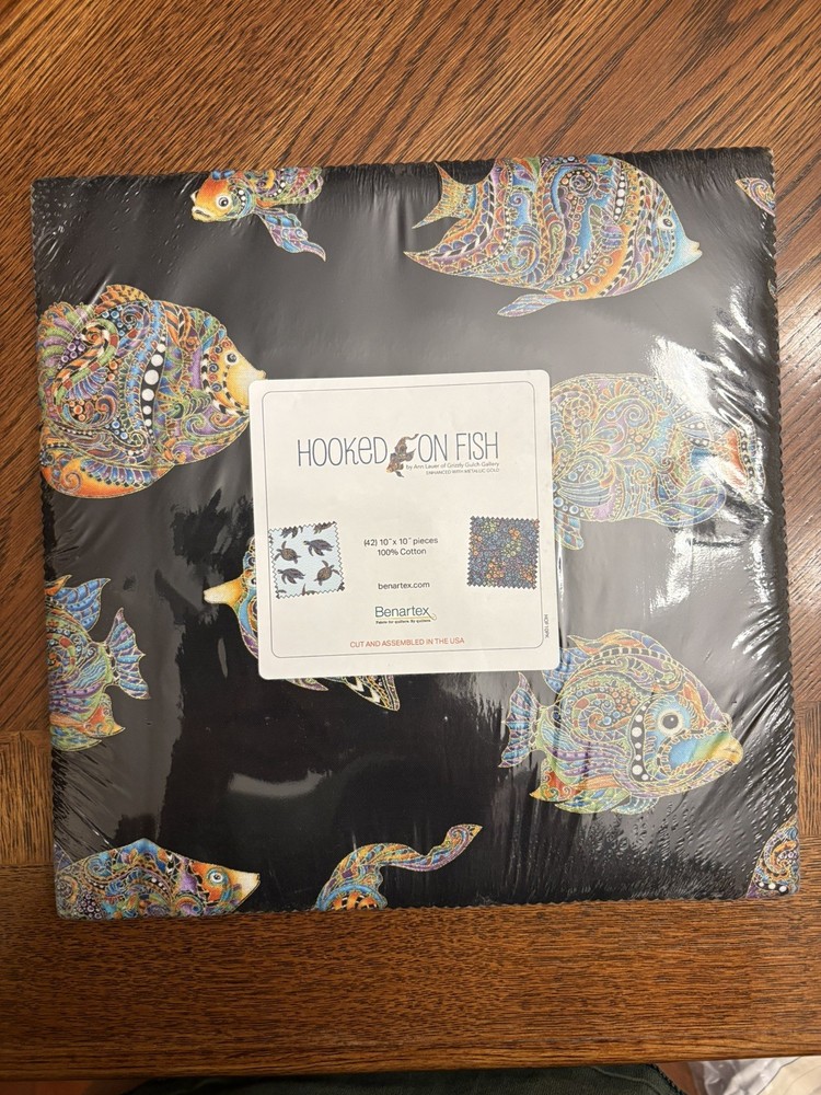 Hooked on fish layer cake quilting fabric. New