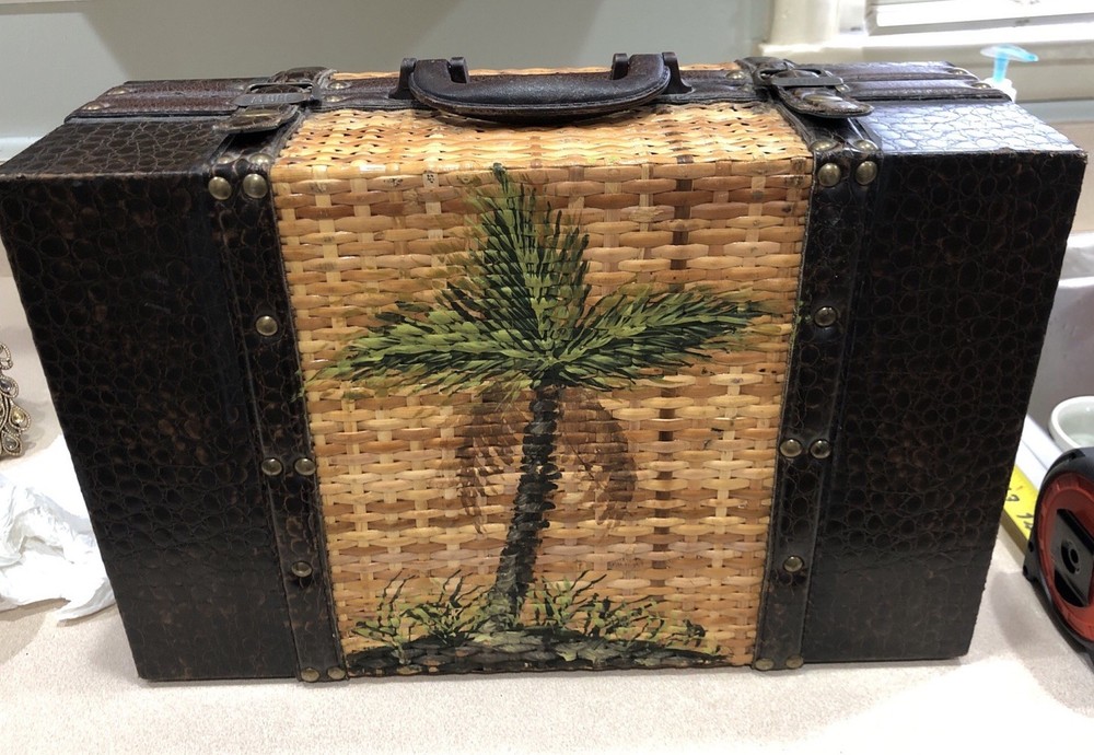 Vintage Ature trunk featuring a hand-painted palm tree