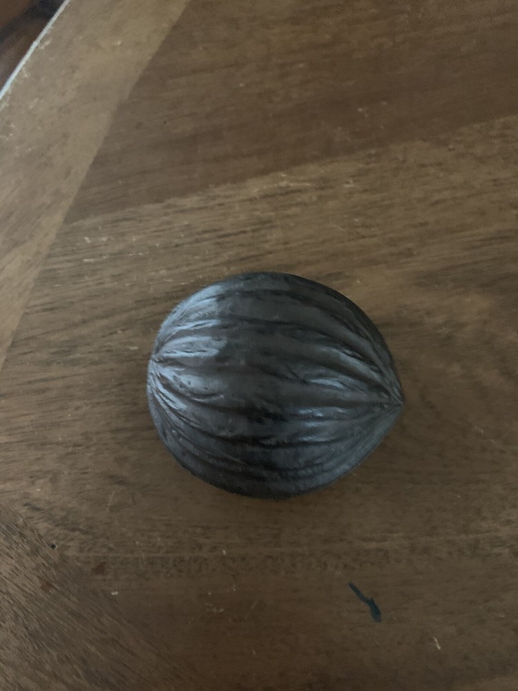 cast iron walnut shaped paper weight brown