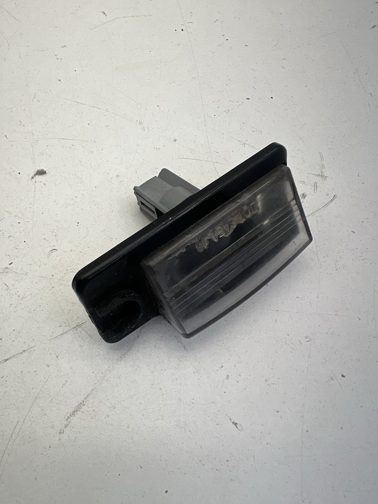 2014-2020 Nissan Rogue 2.5L License Plate Light OEM.