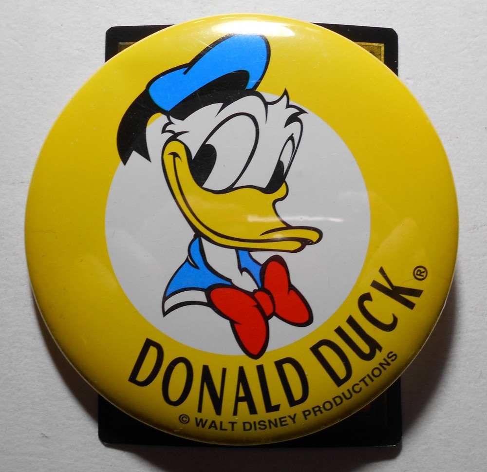 D529- Disney yellow ring Donald Duck cello pinback button