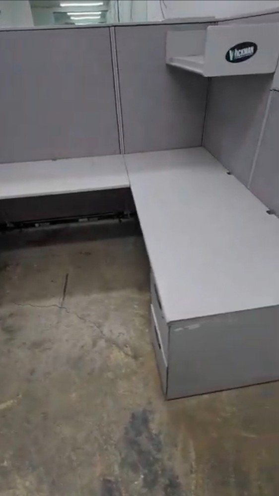 Eight used office cubicles and office desk.