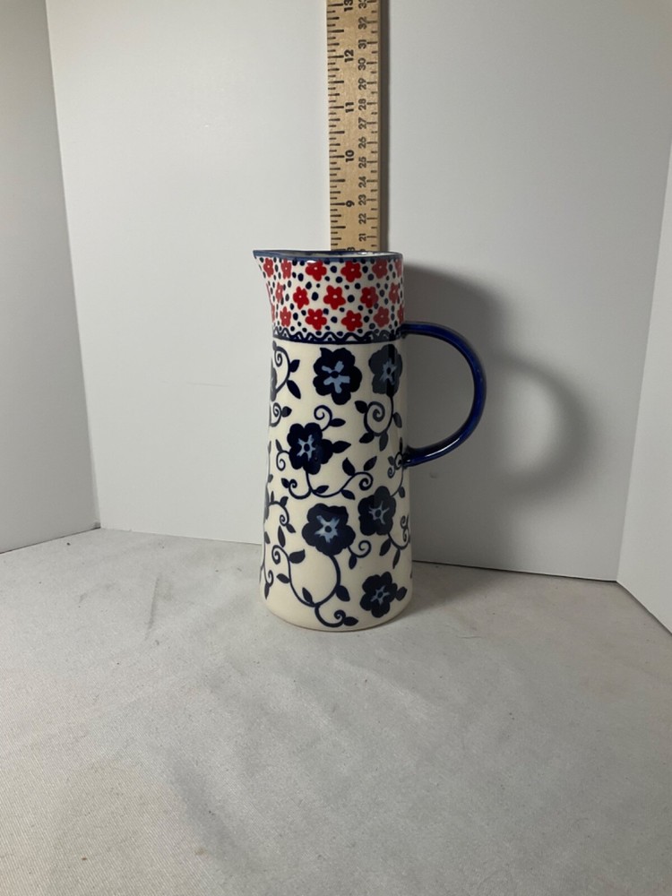 Decorative blue and red flowered pitcher 8”