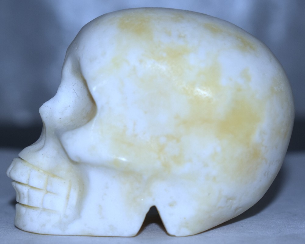 Pretty Orange Calcite Skull 2.95"/288 Grams