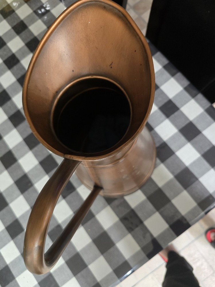 A masterpiece. An antique copper vase.