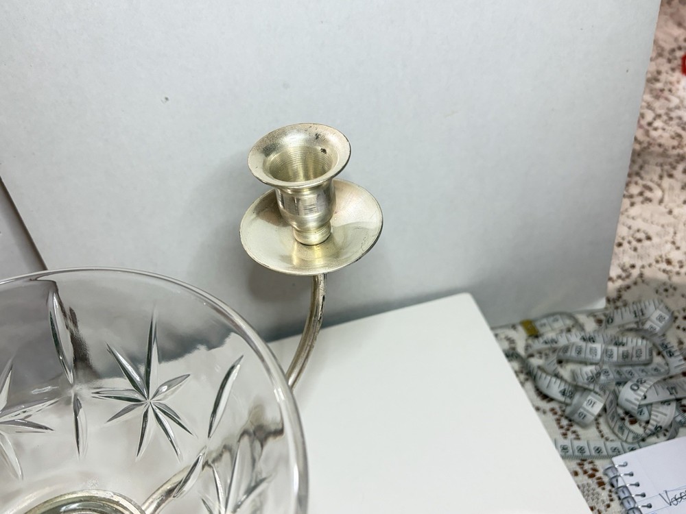 silver candlesticks with three arms and including a central glass bowl
