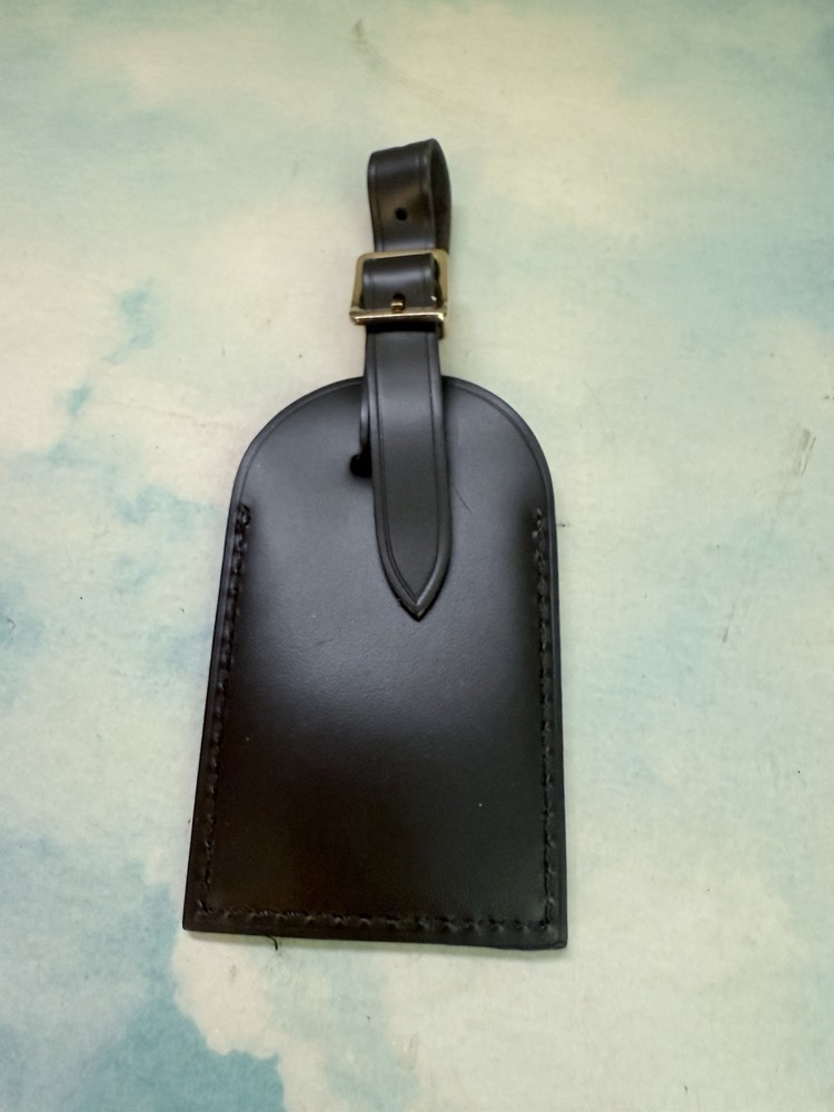 Authentic Louis Vuitton Brown leather name tag. Initialed YM