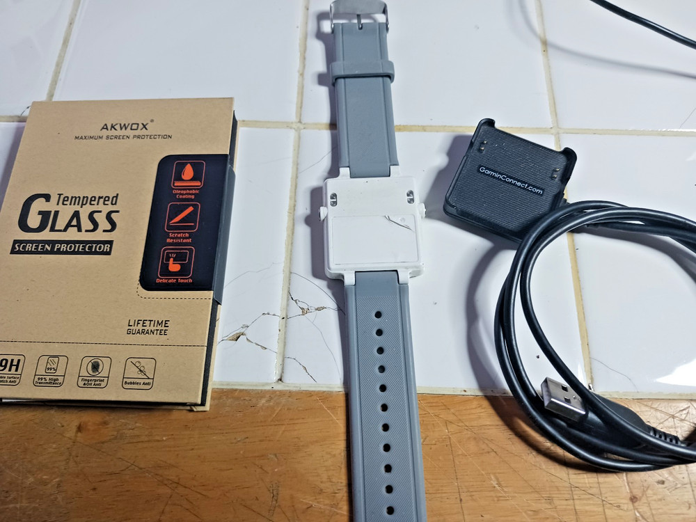 Garmin Vivactive Smart Watch, charger, and covers