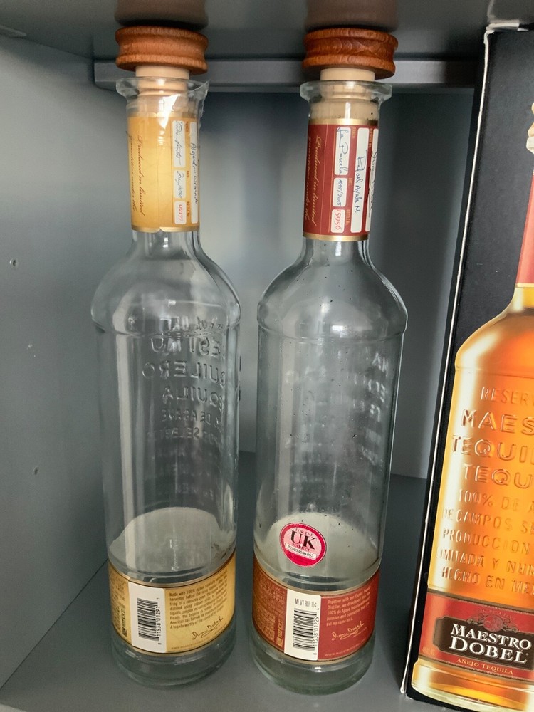 x2 Maestro Dobel reposado and anejo tequila empty bottles