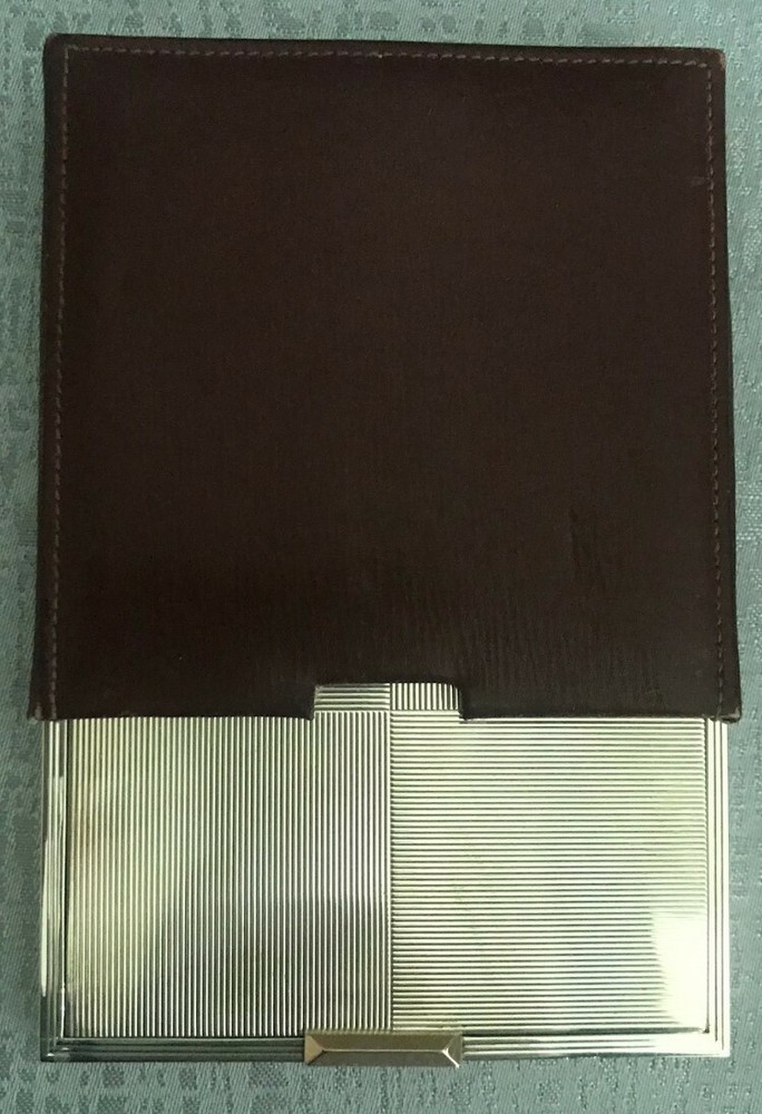 Hallmarked silver compact case with a leather cover