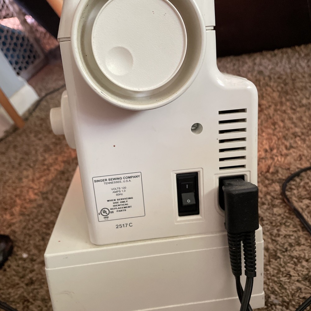 Singer Sewing Machine model 2517C with pedal 130V Tested does work!