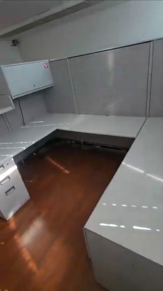 Eight used office cubicles and office desk.