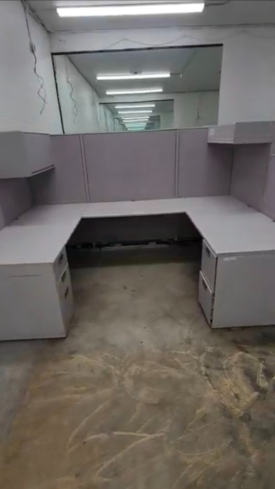 Eight used office cubicles and office desk.