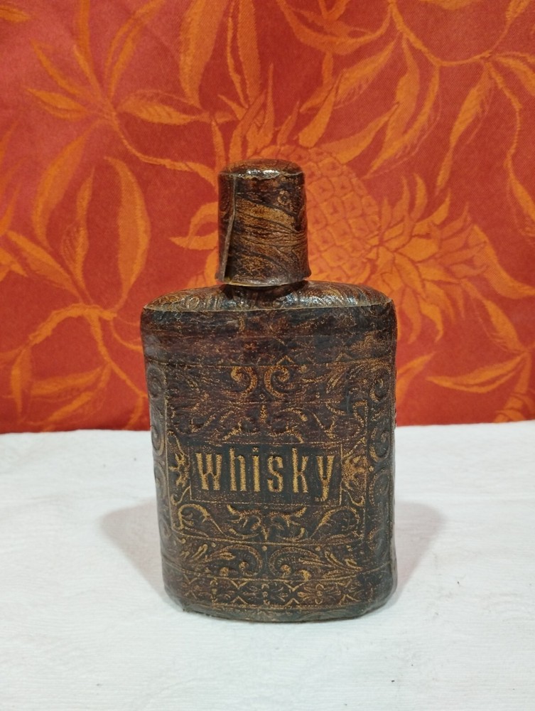 antique Whisky flask, sheathed in embossed imitation leather