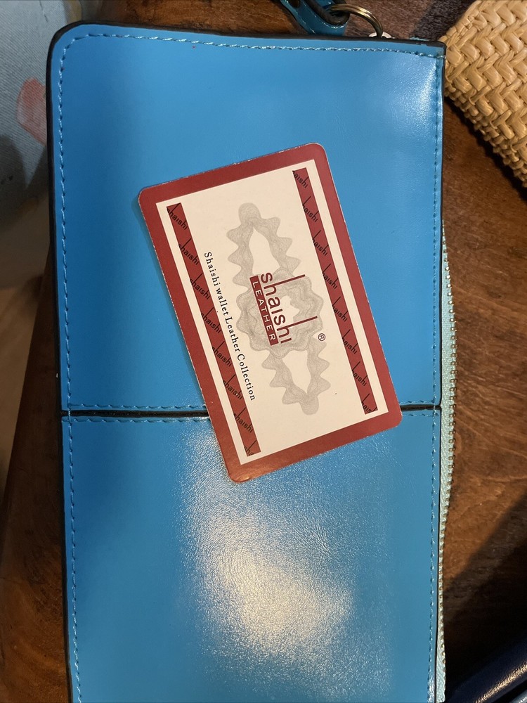 shaishi Leather Wristlet.  Beautiful Blue With Pink Inside.