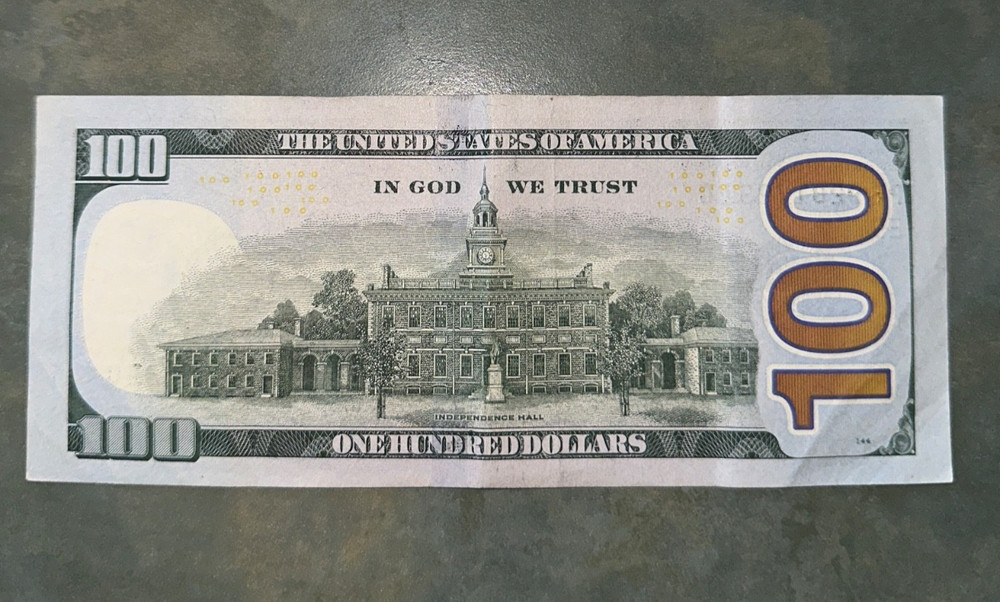 100 Dollar bill with miscut error heavy on top (2017 Series A)