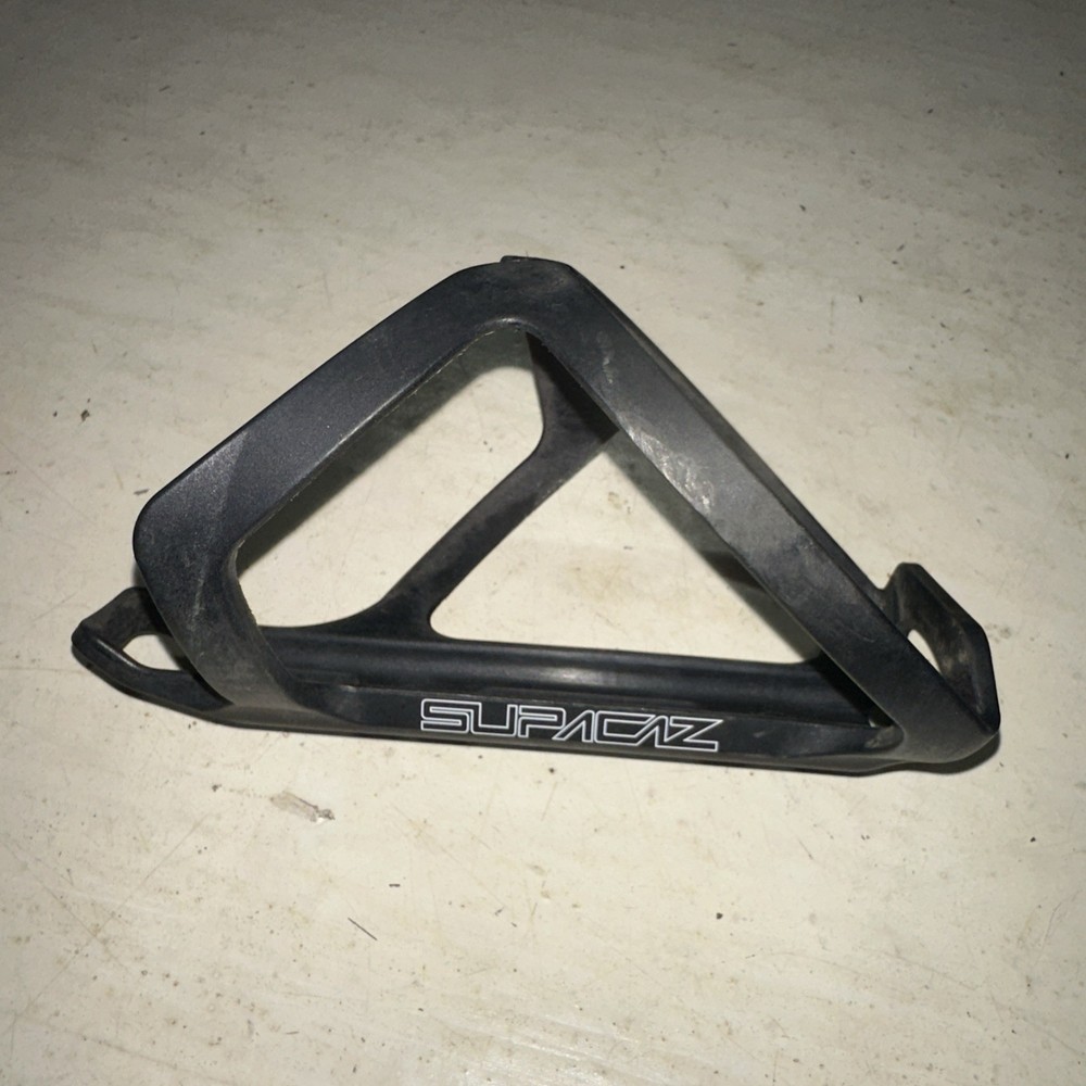 Supacaz Tron Poly Bottle Cage Black Side Loader Right Hand Load White Graphic