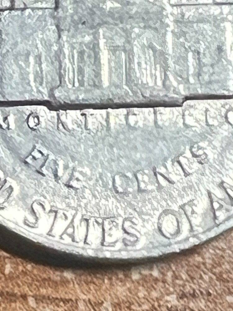1982 ERROR JEFFERSON NICKEL STRUCK THROUGH AN OBJECT