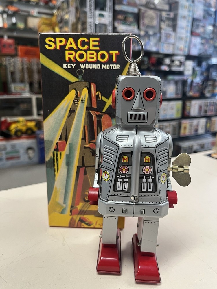 * SPACE ROBOT KEY WOUND MOTOR WITH SPARKING EYES SILVER *ST