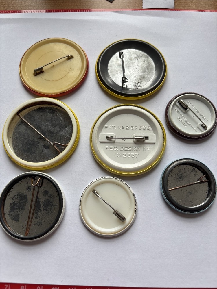 Eight Mixed Pin Badges.