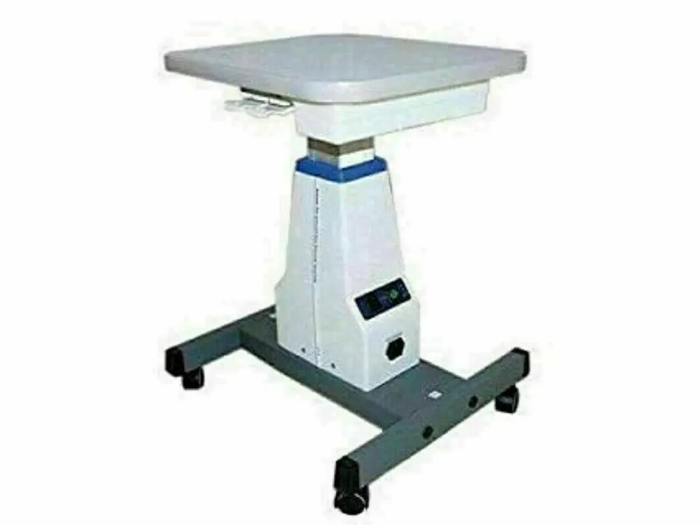 Universal motorized table for slit lamp