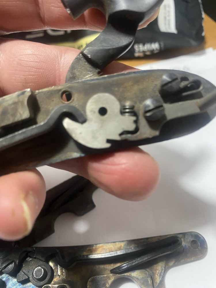 CVA Frointier Muzzleloader Lock and two screws.