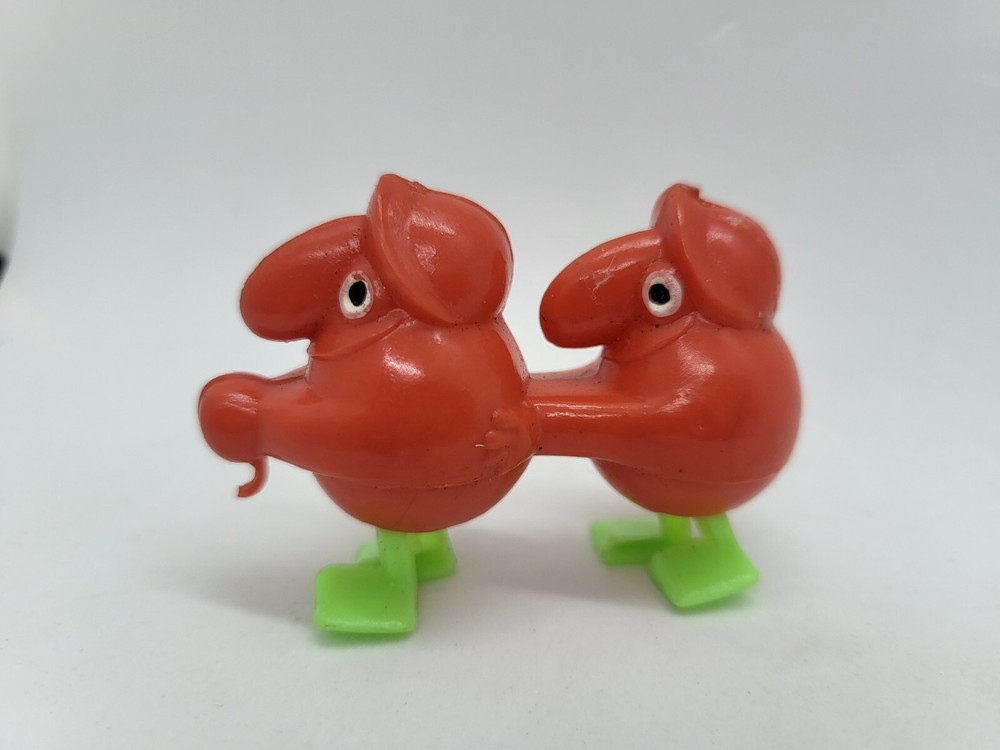 Vintage Minature Red Plastic Goon Walking