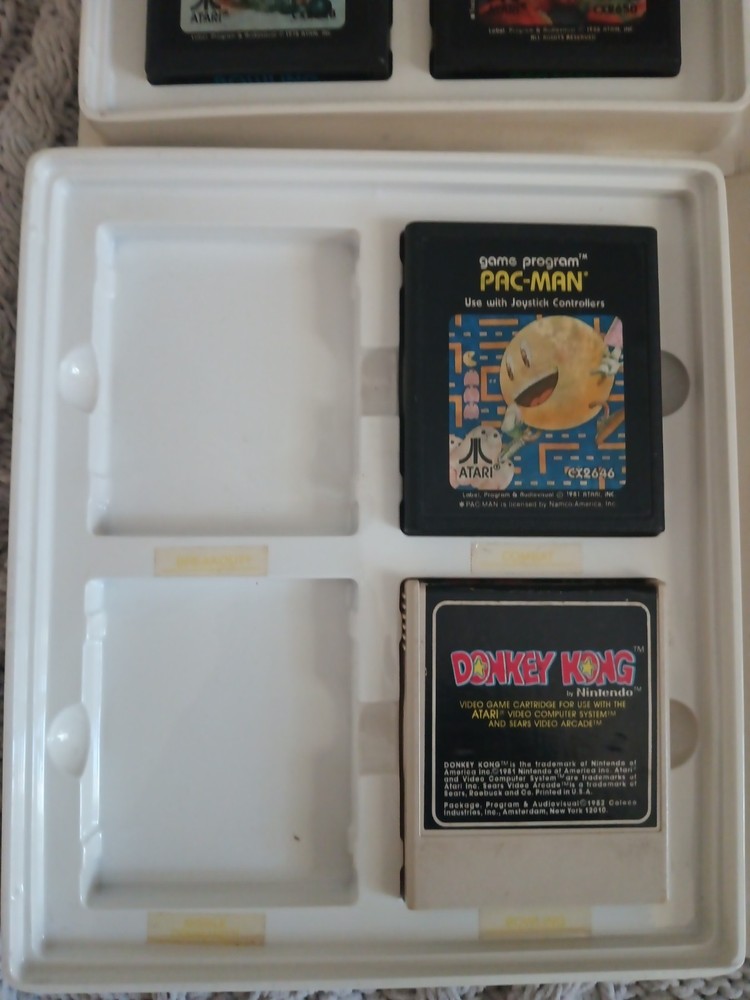 Vintage Atari 2600 Game lot with Atari Original storage cases, untested