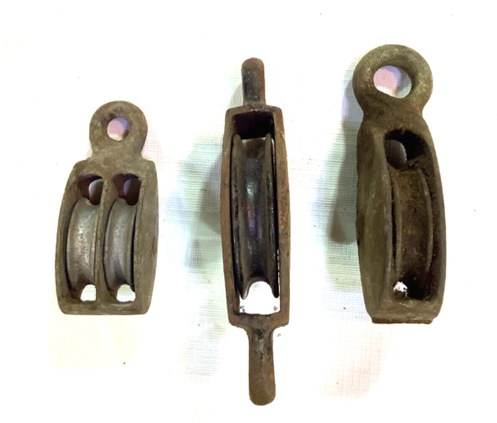 3 Vintage small metal pulleys
