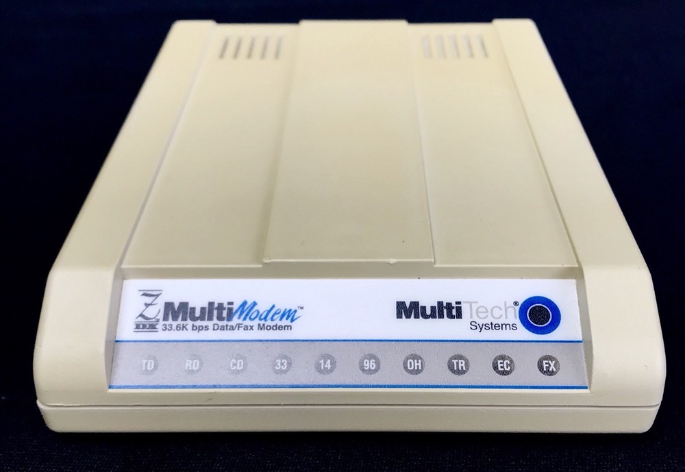 Used MultiTech Light Gray MTZ2834ZDX External 33.6K Data/Fax Modem