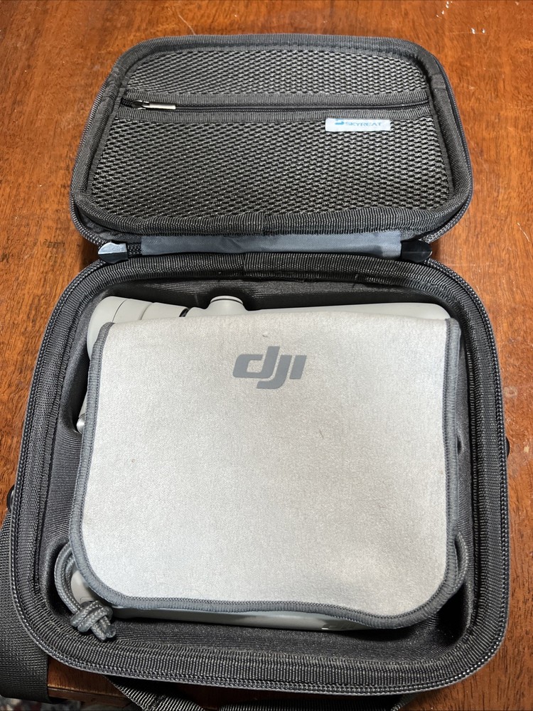 DJI OM 5 3-Axis Smartphone Gimbal Stabilizer. Includes Hard Case And Pouch