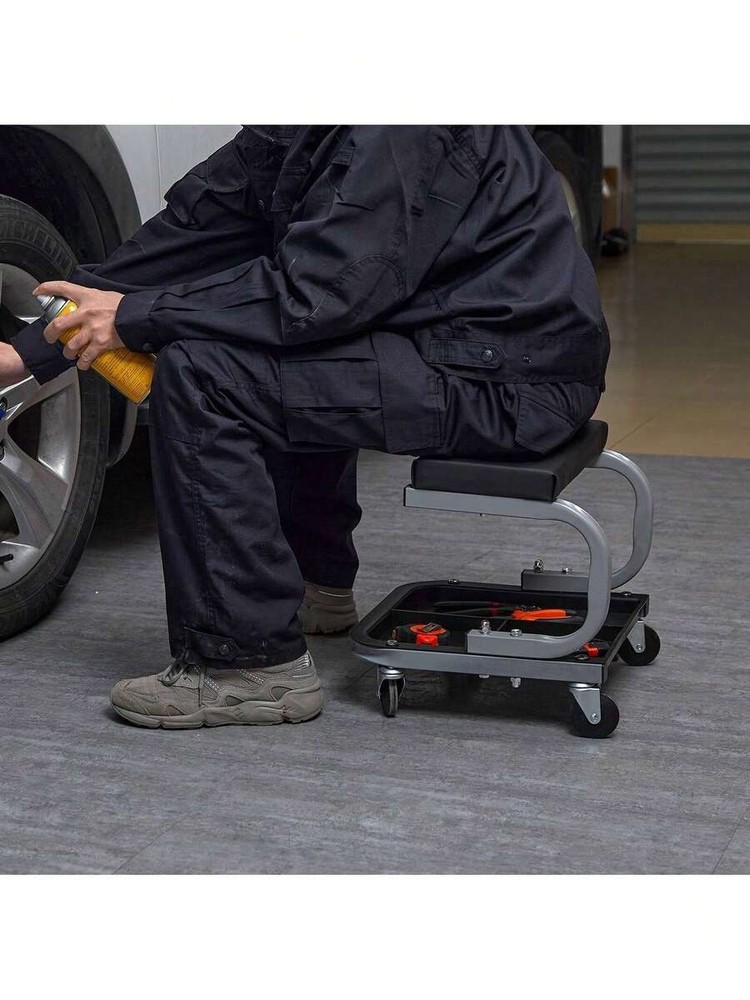 Black garage work stool with wheels, 250 lbs capacity, padded.