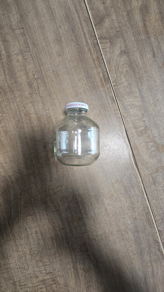 Martinelli's empty 10 fl oz apple juice bottle
