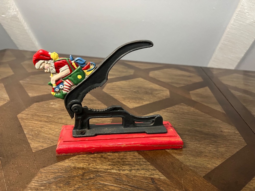 Old Fashioned Nutcracker Cast Iron on Wood Base santa theme nutcracker vintage