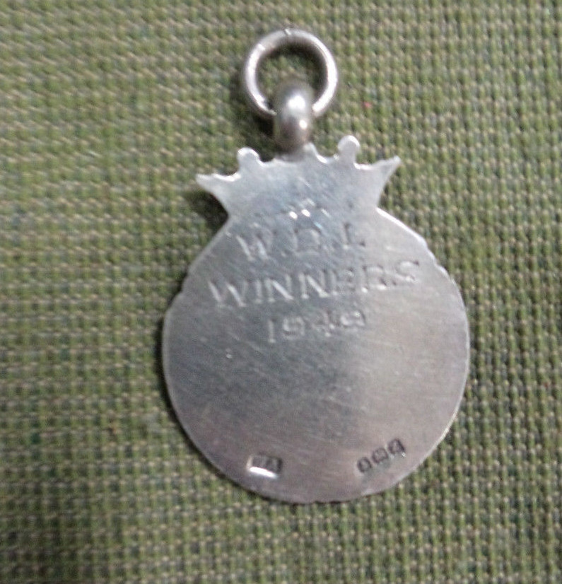 #S3. 1949 DARTS SILVER FOB