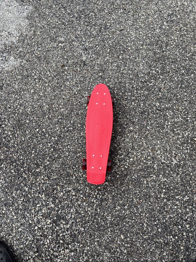 Red Plastic Skateboard With Red Rubber Wheels