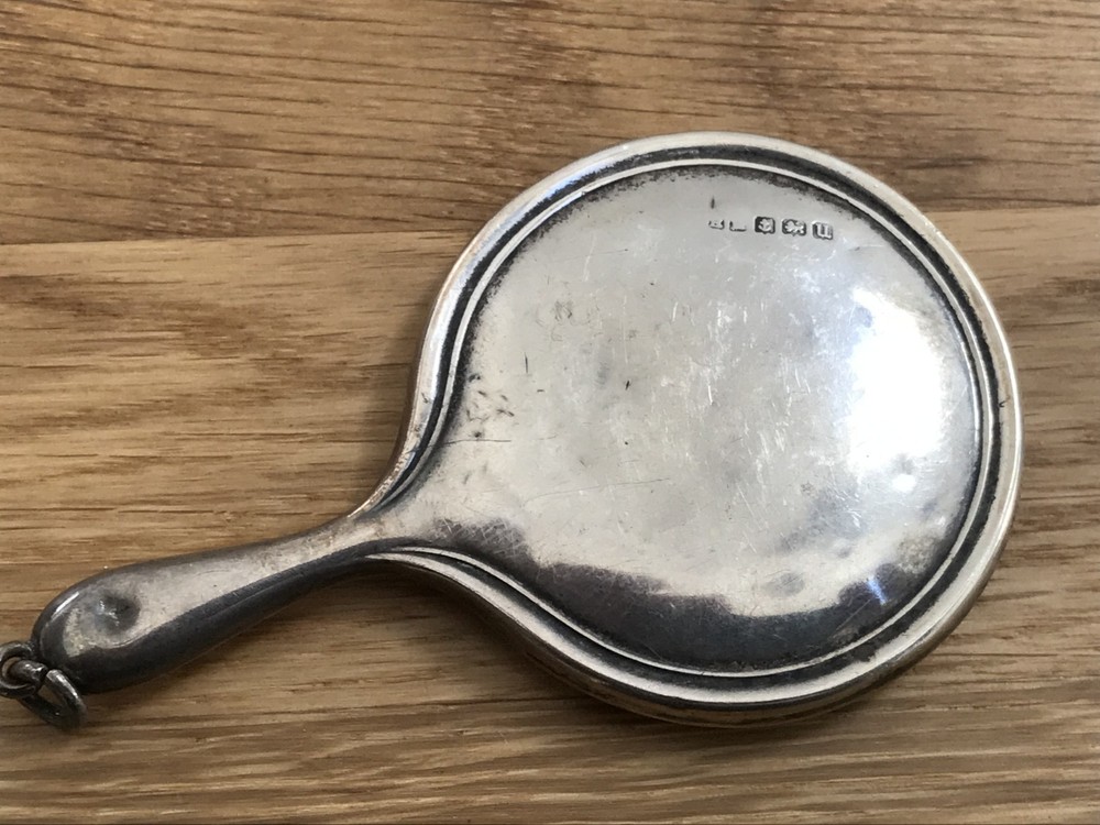 nice looking small size solid silver vanity mirror