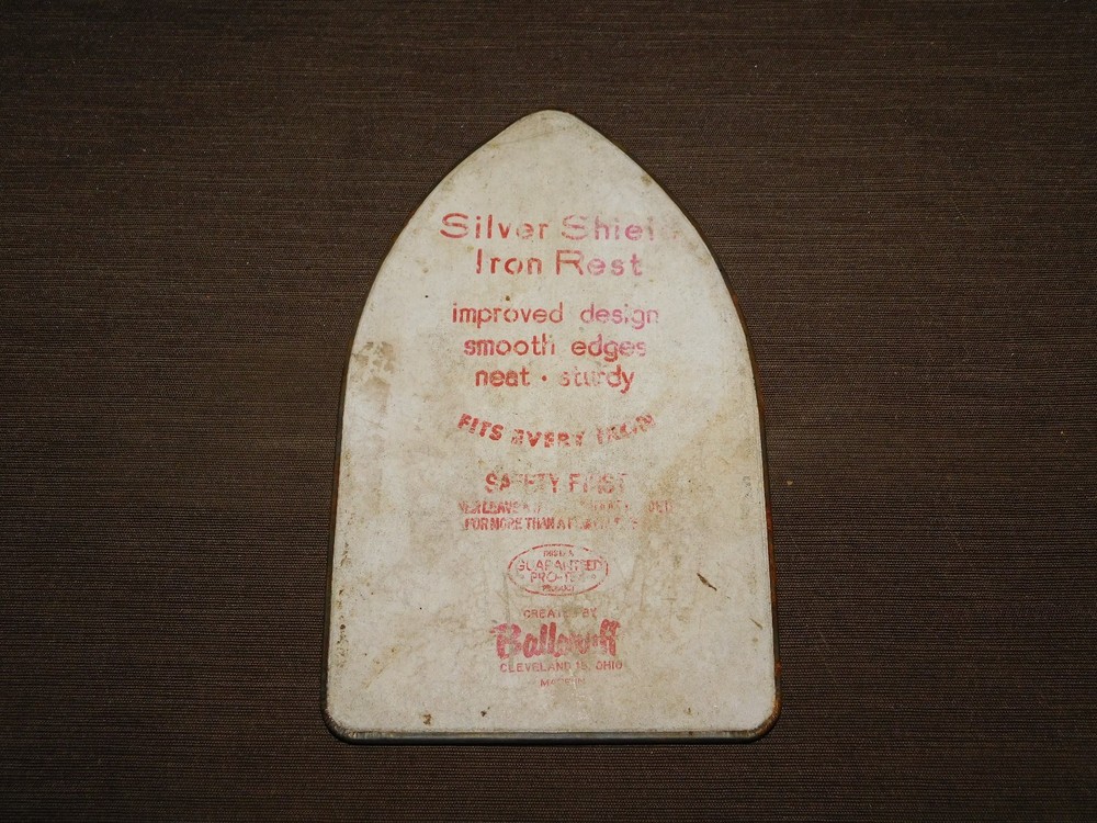 VINTAGE KITCHEN 8 3/4" HIGH SILVER SHIELD IRON REST