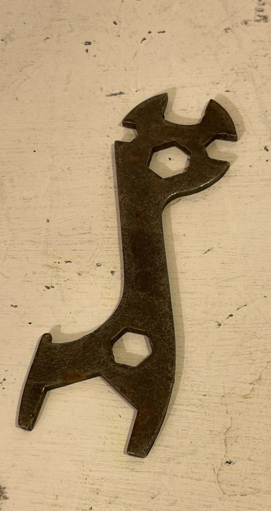 A vintage British mullti-use bicycle spanner